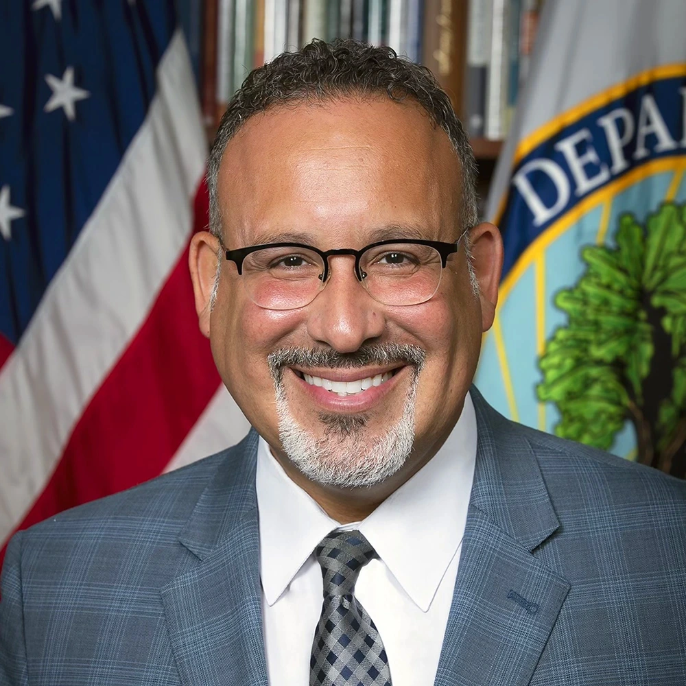 Dr. Miguel Cardona